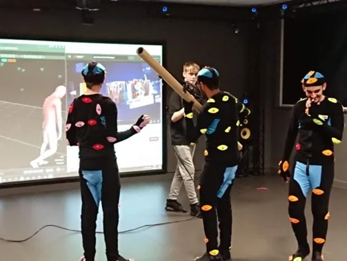 A motion capture session with marker suits